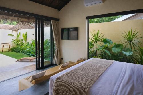 Nala Villas — villa compound with palm trees and tropical garden
